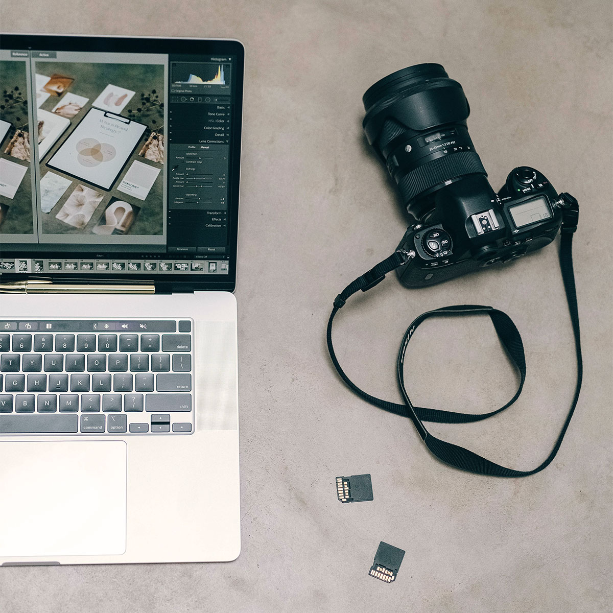 DSLR camera and laptop with editing software open, illustrating Visible PR’s combined photography and website design process.