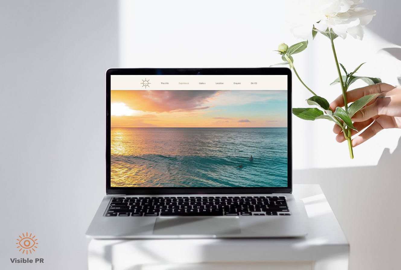 Laptop showing a modern vacation rental website with a tropical Puerto Rico aesthetic, illustrating professional web design for vacation rentals by Visible PR.